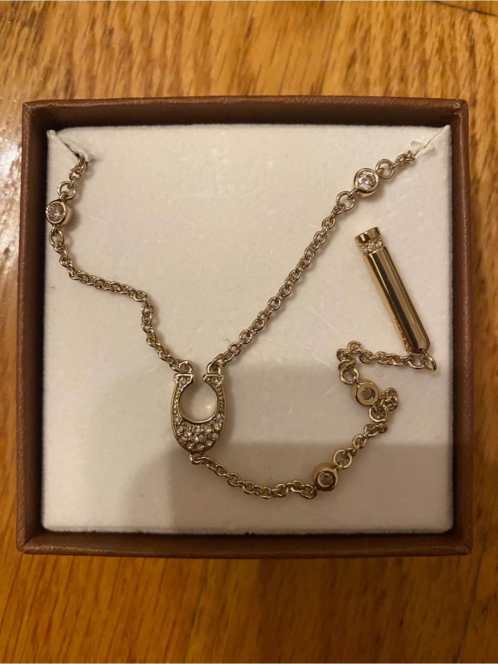 Coach Gold-Tone Horseshoe Pendant Necklace with Crystals